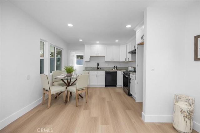 201 S Melrose St, Placentia, CA 92870 - kitchen featuring gas range oven, black dishwasher, baseboards, white cabinetry, and recessed lighting
