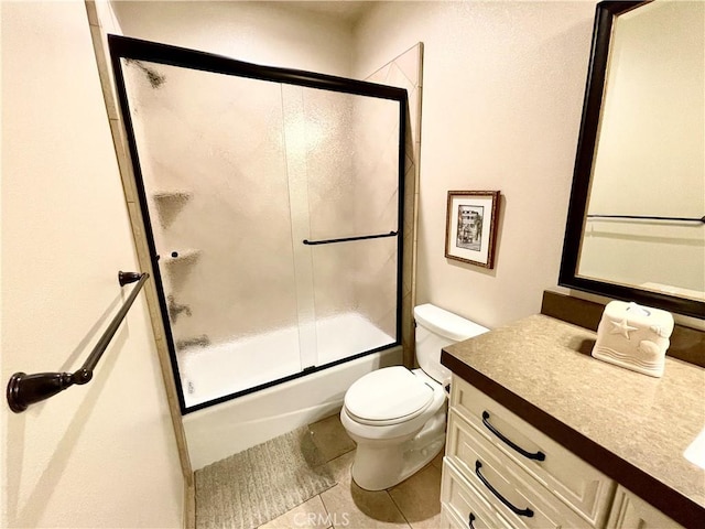 1371 Silhouette Ct, Merced, CA 95340 - bathroom with vanity, toilet, tile patterned flooring, and shower / bath combination with glass door