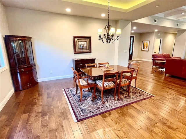 1371 Silhouette Ct, Merced, CA 95340 - dining area with hardwood / wood-style flooring, a chandelier, recessed lighting, and baseboards