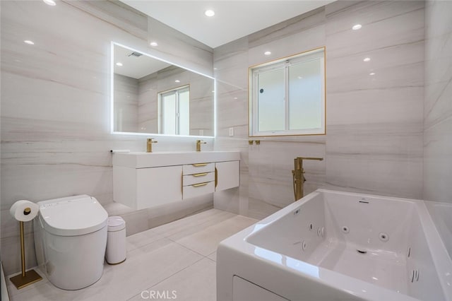 410 Audraine Dr, Glendale, CA 91202 - bathroom with a whirlpool tub, toilet, tile walls, double vanity, and tile patterned flooring