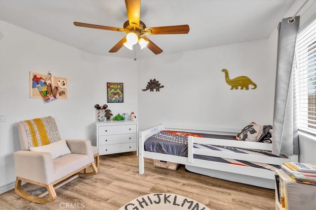 5947 Lupine Ave Unit 29, Palms, CA 92277 - bedroom featuring wood finished floors and ceiling fan