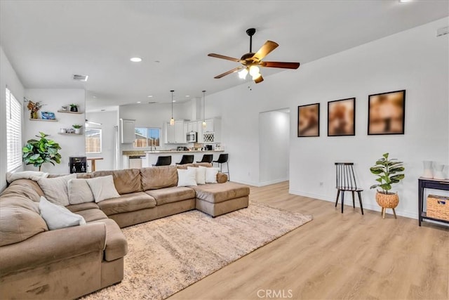 5947 Lupine Ave Unit 29, Palms, CA 92277 - living room featuring plenty of natural light, ceiling fan, light wood-style floors, baseboards, and recessed lighting