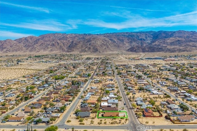 5947 Lupine Ave Unit 29, Palms, CA 92277 - aerial perspective of suburban area with a mountainous background and property parcel outlined