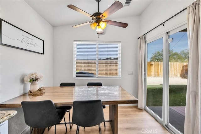 5947 Lupine Ave Unit 29, Palms, CA 92277 - dining area with light wood finished floors and ceiling fan
