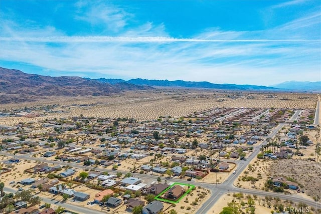5947 Lupine Ave Unit 29, Palms, CA 92277 - aerial perspective of suburban area featuring a mountain backdrop and a desert landscape