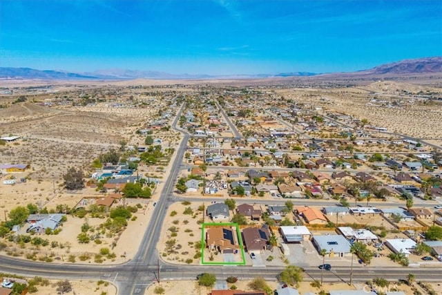 5947 Lupine Ave Unit 29, Palms, CA 92277 - aerial view of residential area featuring a mountainous background and a desert landscape