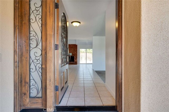 8072 Sundance Ln, La Palma, CA 90623 - hall with light tile patterned floors and a textured wall