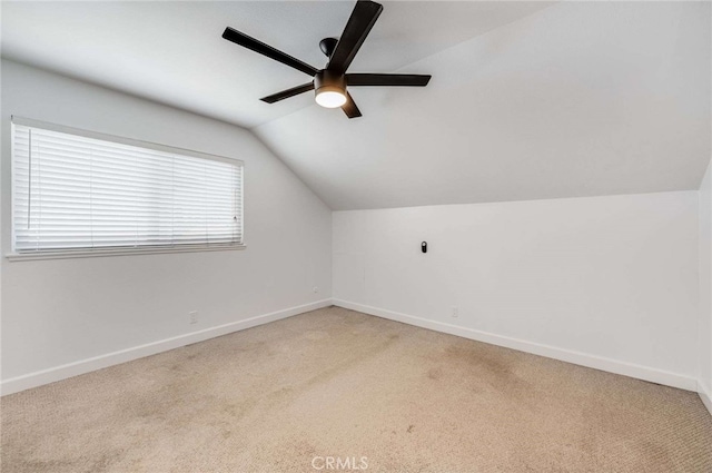 8072 Sundance Ln, La Palma, CA 90623 - additional living space with light carpet, a ceiling fan, vaulted ceiling, and baseboards