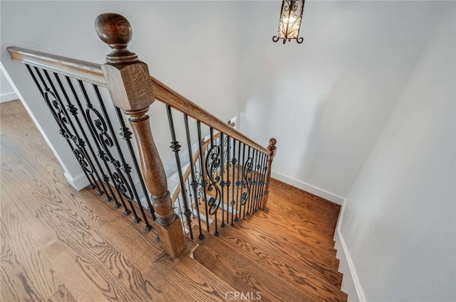 8072 Sundance Ln, La Palma, CA 90623 - stairway with wood finished floors and baseboards
