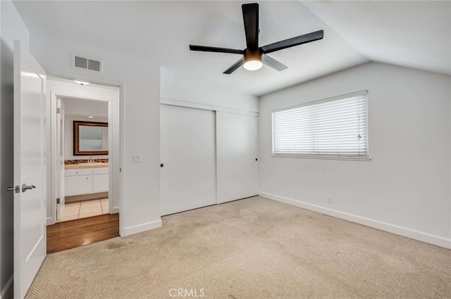 8072 Sundance Ln, La Palma, CA 90623 - unfurnished bedroom with carpet floors, a closet, lofted ceiling, baseboards, and ceiling fan