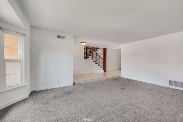 8072 Sundance Ln, La Palma, CA 90623 - unfurnished room with stairway, carpet, healthy amount of natural light, and baseboards