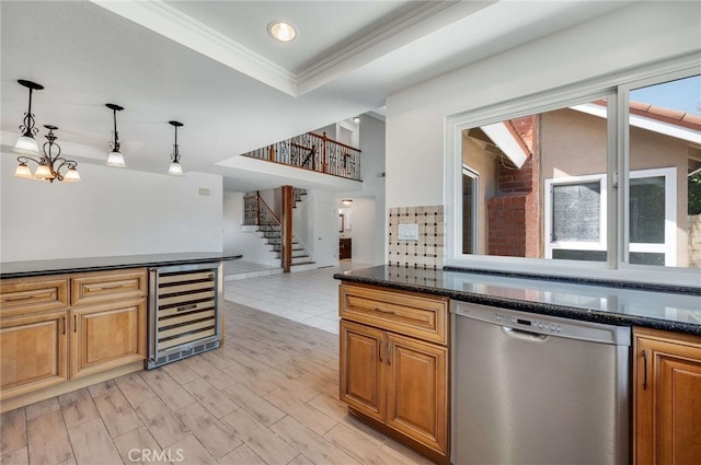 8072 Sundance Ln, La Palma, CA 90623 - kitchen featuring dishwasher, beverage cooler, ornamental molding, pendant lighting, and dark stone countertops