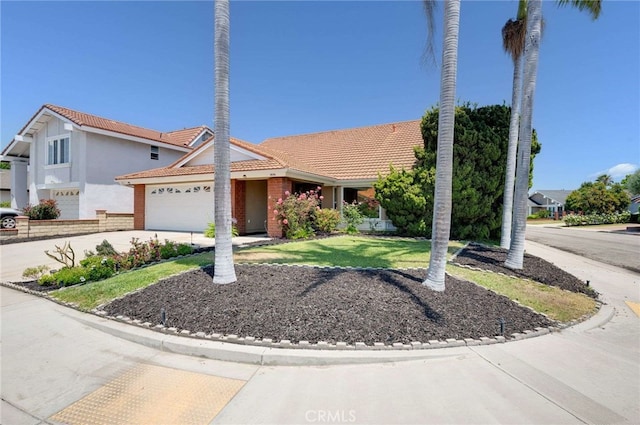 8072 Sundance Ln, La Palma, CA 90623 - view of front of house with concrete driveway, a garage, a front yard, and a tile roof