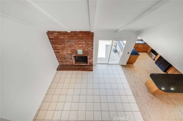 8072 Sundance Ln, La Palma, CA 90623 - unfurnished living room with beam ceiling, tile patterned flooring, and a fireplace