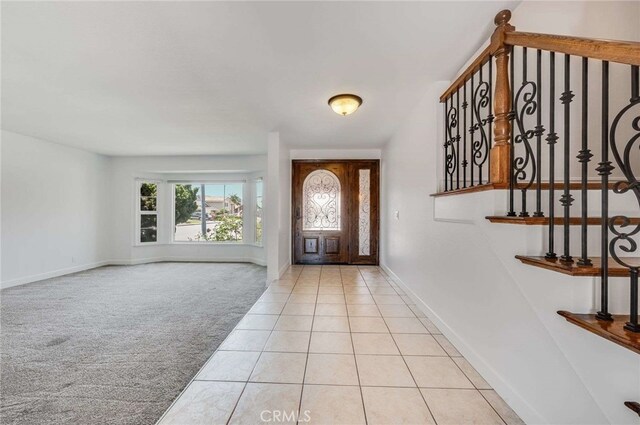 8072 Sundance Ln, La Palma, CA 90623 - carpeted foyer with baseboards and tile patterned floors