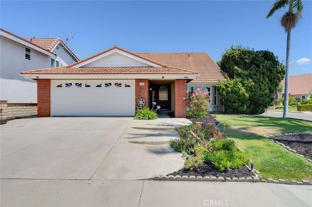 8072 Sundance Ln, La Palma, CA 90623 - view of front of property with an attached garage, driveway, a tiled roof, and brick siding