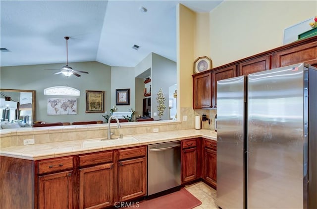 2267 Lorena Ave, Sanger, CA 93657 - kitchen with appliances with stainless steel finishes, open floor plan, a sink, a peninsula, and ceiling fan