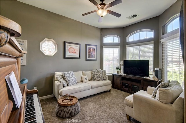 2267 Lorena Ave, Sanger, CA 93657 - carpeted living room with ceiling fan and baseboards