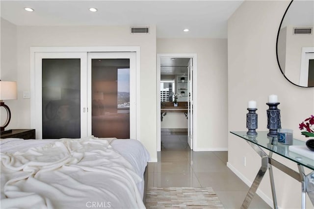 2160 Century Park E Unit 1512, Los Angeles, CA 90067 - bedroom with tile patterned floors, a closet, recessed lighting, and baseboards