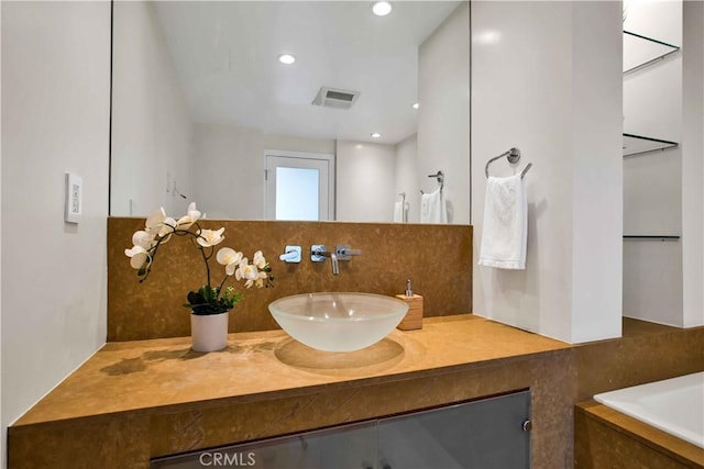 2160 Century Park E Unit 1512, Los Angeles, CA 90067 - full bathroom with vanity, recessed lighting, and a bathtub