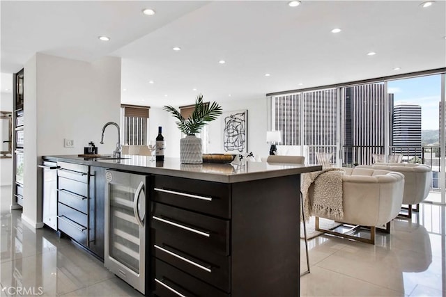 2160 Century Park E Unit 1512, Los Angeles, CA 90067 - kitchen featuring beverage cooler, recessed lighting, a sink, light tile patterned floors, and open floor plan