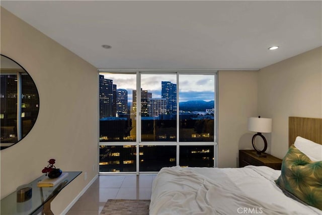 2160 Century Park E Unit 1512, Los Angeles, CA 90067 - tiled bedroom featuring a city view and expansive windows