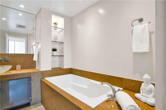 2160 Century Park E Unit 1512, Los Angeles, CA 90067 - full bathroom with a garden tub, recessed lighting, vanity, and decorative backsplash