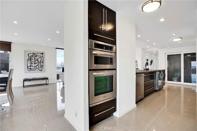 2160 Century Park E Unit 1512, Los Angeles, CA 90067 - kitchen with stainless steel appliances, light tile patterned floors, recessed lighting, wine cooler, and dark brown cabinets