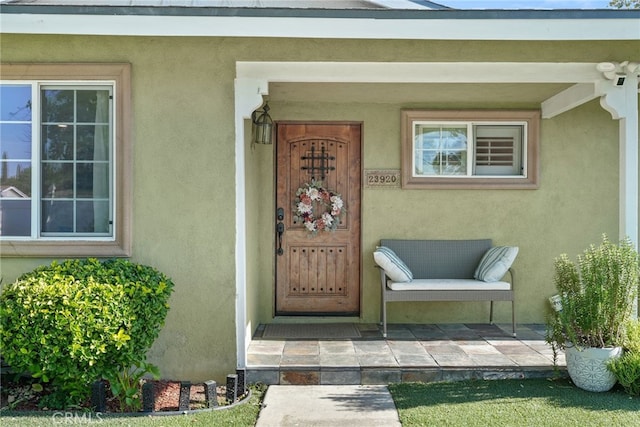 23920 Vanowen St, West Hills, CA 91307 - property entrance featuring stucco siding