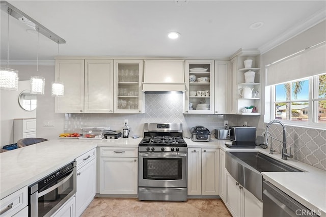 23920 Vanowen St, West Hills, CA 91307 - kitchen with appliances with stainless steel finishes, a sink, backsplash, crown molding, and light countertops