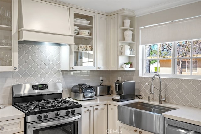 23920 Vanowen St, West Hills, CA 91307 - kitchen with stainless steel appliances, a sink, open shelves, light countertops, and crown molding