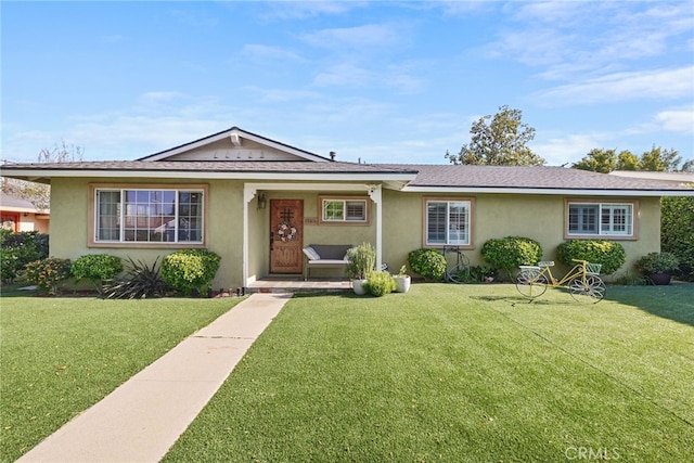 23920 Vanowen St, West Hills, CA 91307 - view of front facade featuring a front yard and stucco siding