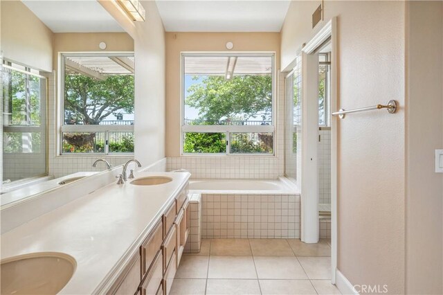 28291 La Plumosa, Laguna Niguel, CA 92667 - full bathroom with double vanity, tiled bath, and tile patterned flooring