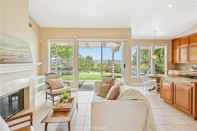 28291 La Plumosa, Laguna Niguel, CA 92667 - living room with a fireplace, light tile patterned floors, and lofted ceiling