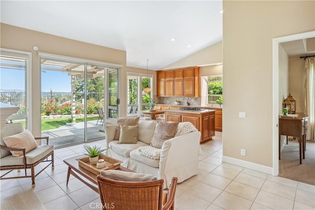 28291 La Plumosa, Laguna Niguel, CA 92667 - living room with light tile patterned flooring, healthy amount of natural light, vaulted ceiling, baseboards, and recessed lighting