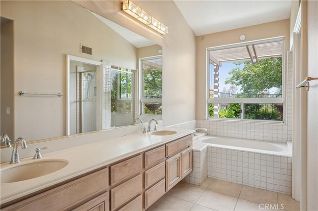 28291 La Plumosa, Laguna Niguel, CA 92667 - full bath featuring tile patterned floors, double vanity, tiled bath, and tiled shower