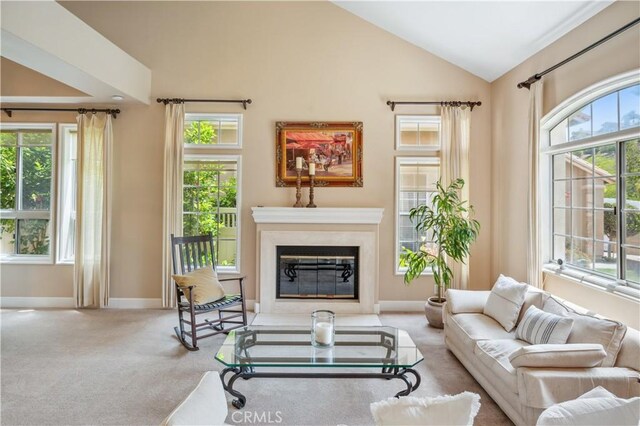 28291 La Plumosa, Laguna Niguel, CA 92667 - living room with lofted ceiling, carpet floors, baseboards, and a glass covered fireplace