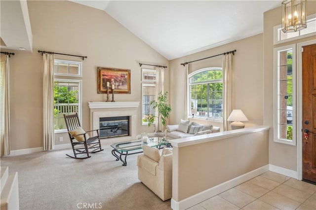 28291 La Plumosa, Laguna Niguel, CA 92667 - living room with vaulted ceiling, a fireplace, baseboards, a chandelier, and light colored carpet