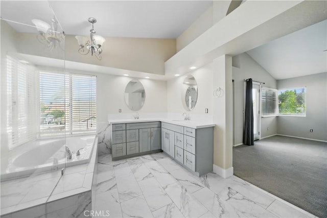 31070 Larchwood St, Menifee, CA 92584 - full bath featuring double vanity, a garden tub, a chandelier, marble finish flooring, and vaulted ceiling