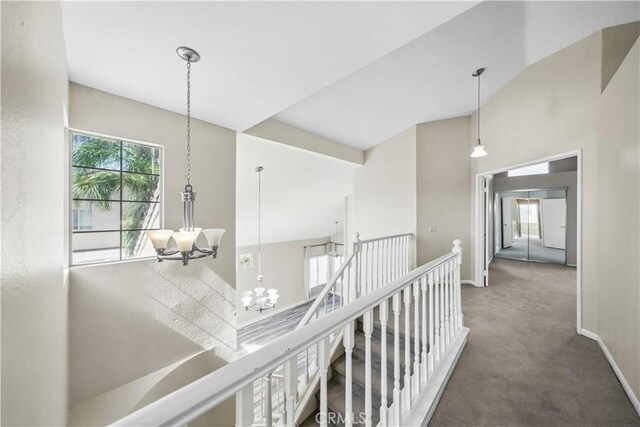 31070 Larchwood St, Menifee, CA 92584 - hall with carpet floors, a chandelier, an upstairs landing, and a high ceiling