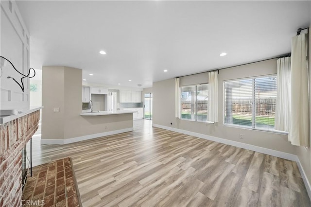 31070 Larchwood St, Menifee, CA 92584 - unfurnished living room with light wood-type flooring and recessed lighting