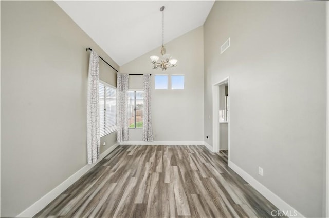 31070 Larchwood St, Menifee, CA 92584 - unfurnished dining area featuring high vaulted ceiling, a chandelier, and wood finished floors