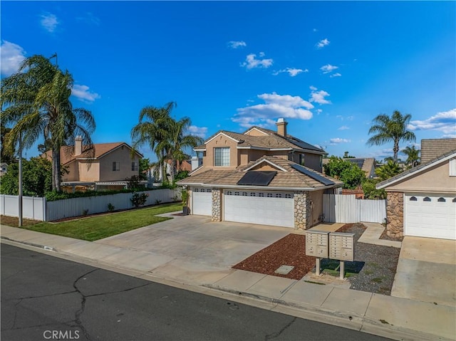 31070 Larchwood St, Menifee, CA 92584 - traditional-style house featuring roof mounted solar panels, stone siding, driveway, a tiled roof, and stucco siding