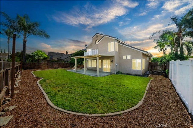 31070 Larchwood St, Menifee, CA 92584 - rear view of property featuring a patio, stucco siding, and a fenced backyard