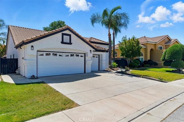 1272 Avenida Roundelay, San Jacinto, CA 92583 - mediterranean / spanish house featuring a garage, stucco siding, concrete driveway, and a tile roof