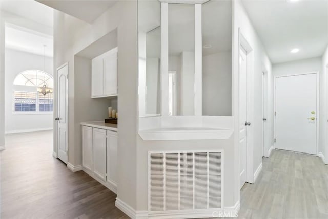 1272 Avenida Roundelay, San Jacinto, CA 92583 - corridor featuring light wood-type flooring, baseboards, and recessed lighting