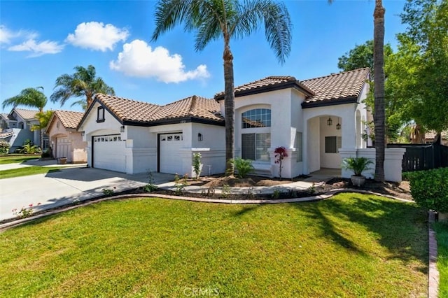1272 Avenida Roundelay, San Jacinto, CA 92583 - mediterranean / spanish home featuring stucco siding, a tile roof, an attached garage, concrete driveway, and a front yard