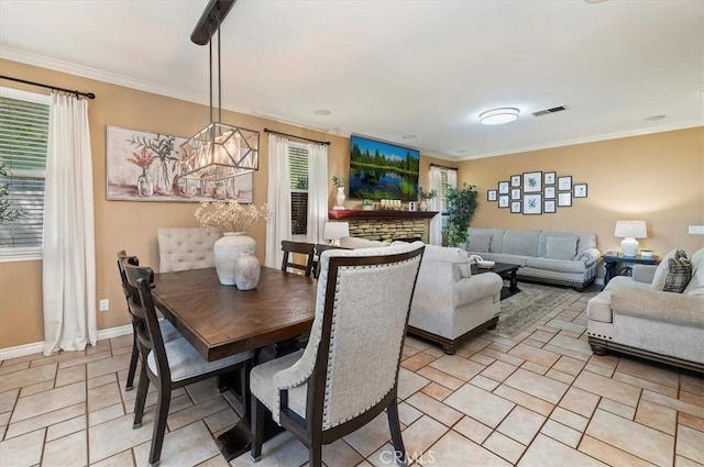 23328 Stone Rdg, Murrieta, CA 92562 - dining area featuring stone tile flooring, ornamental molding, and baseboards