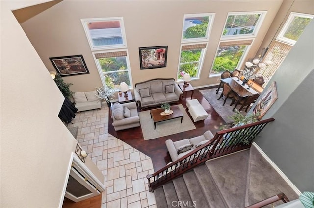 23328 Stone Rdg, Murrieta, CA 92562 - living room featuring a towering ceiling and baseboards
