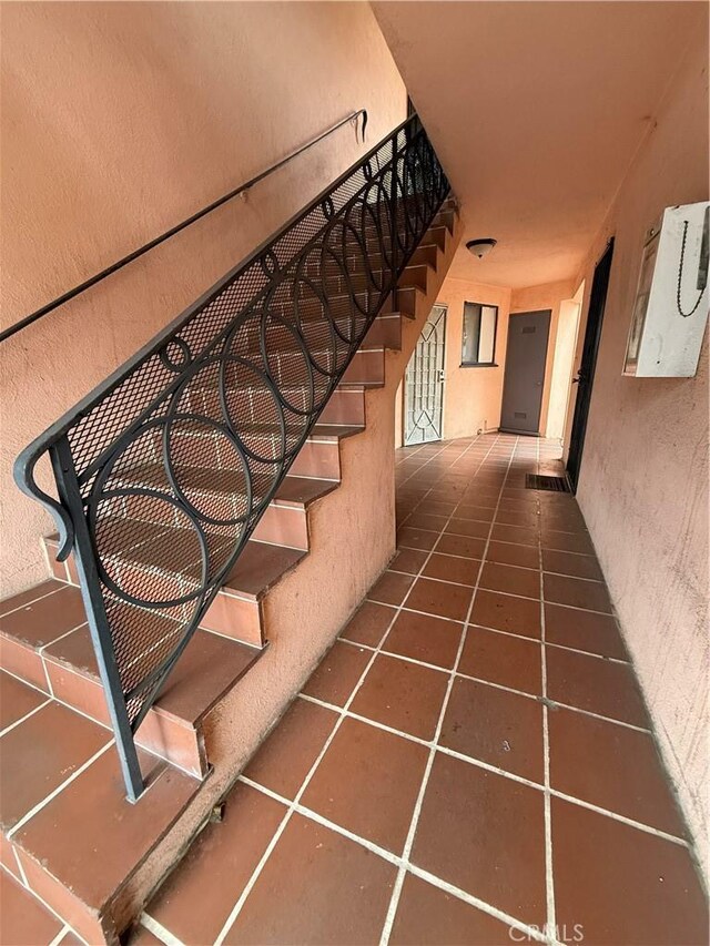 400401GRAND N Atlantic Blvd, Alhambra, CA 91801 - staircase featuring tile patterned floors and a textured wall